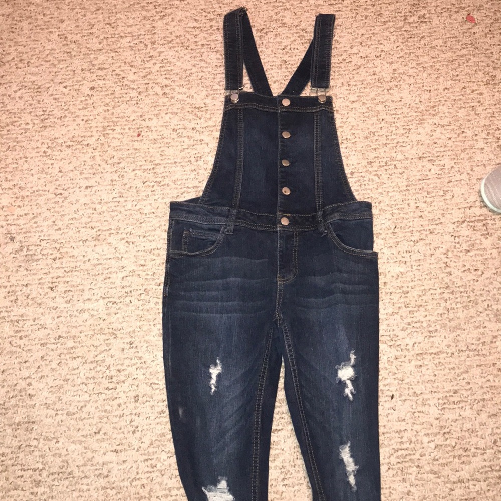 Dark wash overalls from “Tinseltown” in a small